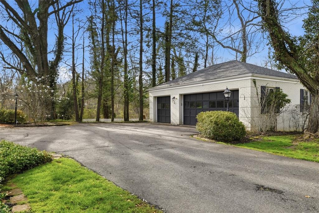 1001 Fox Chapel Road Pittsburgh, PA 15238 - Photo 4 of 50 a front view of a house with a yard and garage