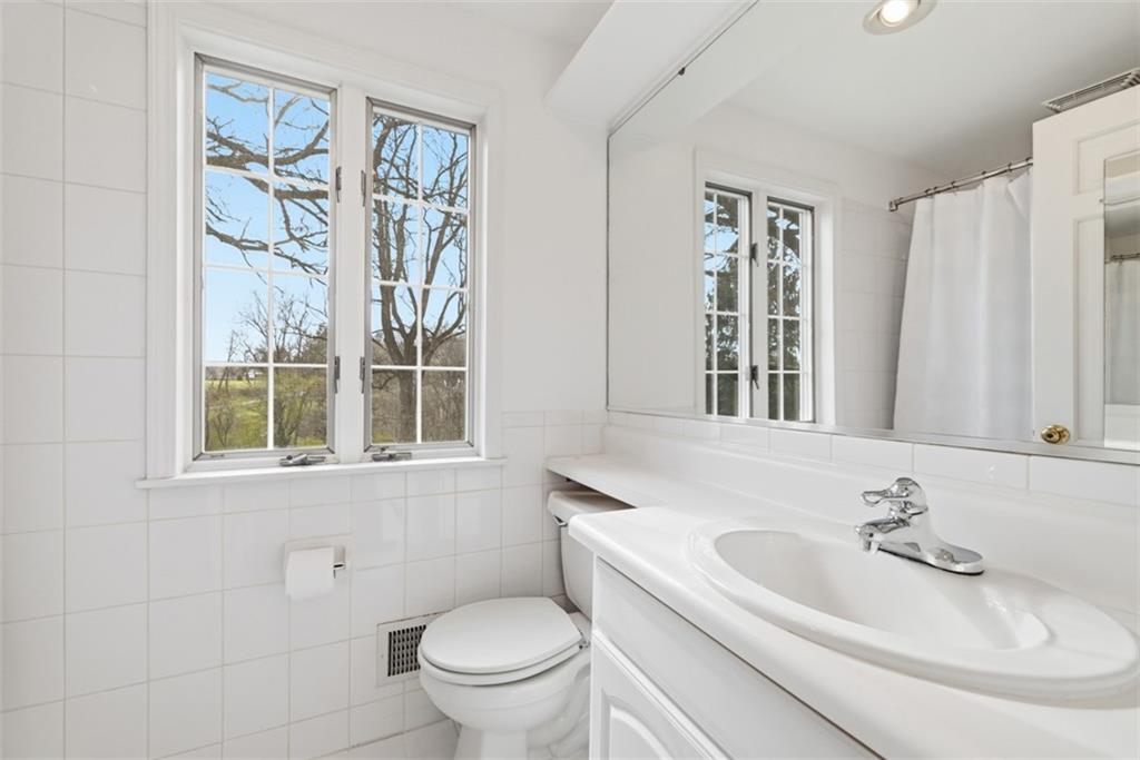 1001 Fox Chapel Road Pittsburgh, PA 15238 - Photo 41 of 50 a bathroom with a sink and a mirror