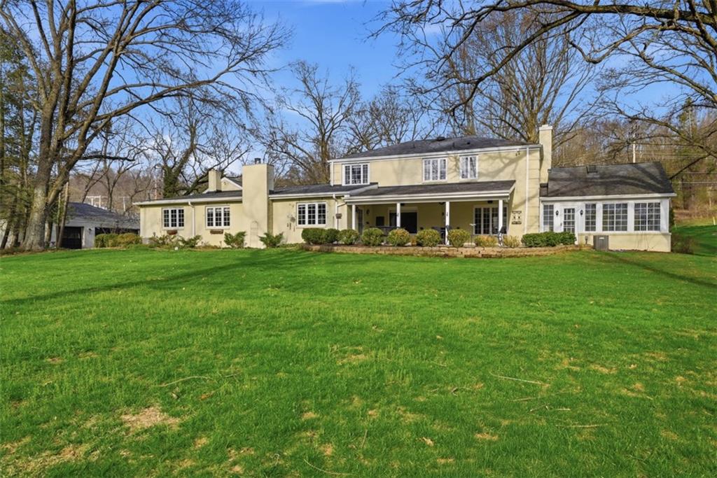 1001 Fox Chapel Road Pittsburgh, PA 15238 - Photo 5 of 50 a front view of a building with a yard