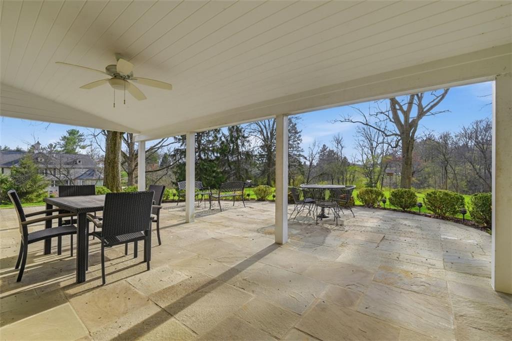 1001 Fox Chapel Road Pittsburgh, PA 15238 - Photo 6 of 50 a view of a patio with a table chairs and a backyard