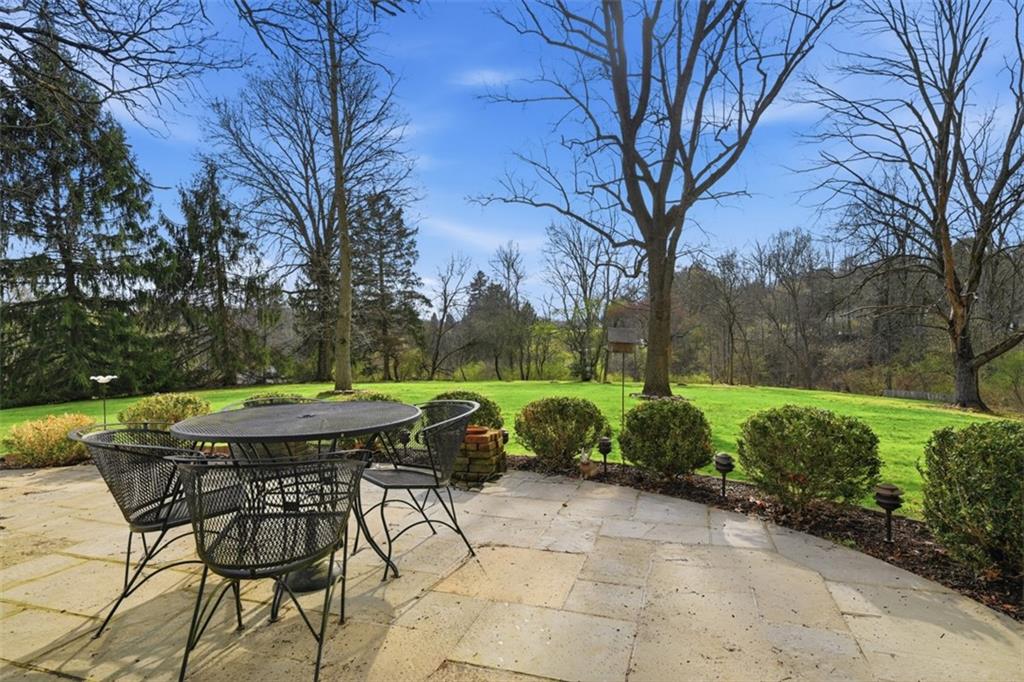 1001 Fox Chapel Road Pittsburgh, PA 15238 - Photo 8 of 50 a view of a table and chairs in backyard of the house