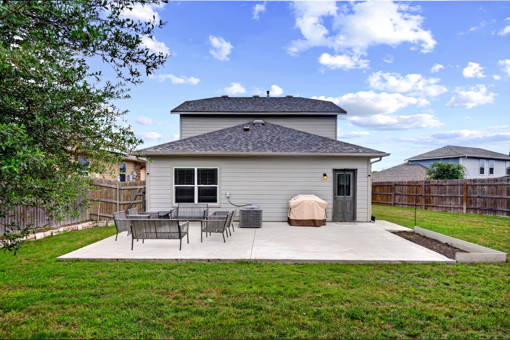 2006 Grow Lane Austin, TX 78754 - Photo 24 of 40 A spacious backyard patio provides ample room for outdoor dining and recreation.