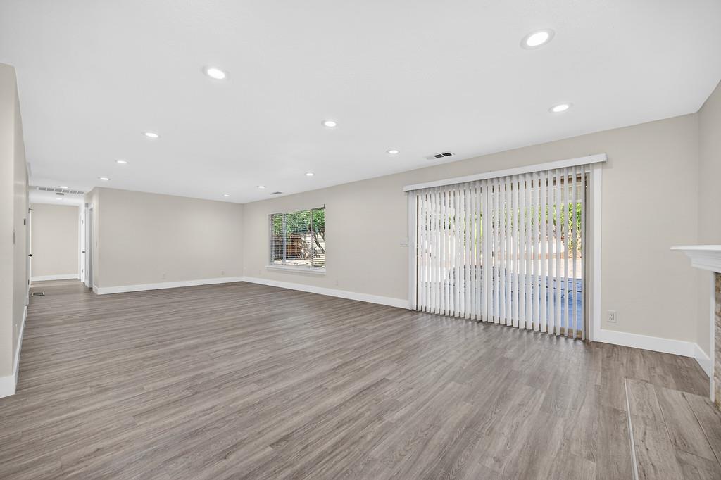 7517 Farmgate Way Citrus Heights, CA 95610 - Photo 11 of 35 an empty room with wooden floor and windows