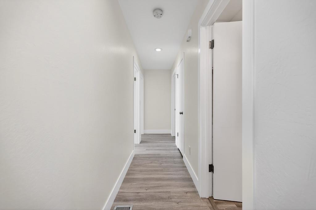 7517 Farmgate Way Citrus Heights, CA 95610 - Photo 20 of 35 a view of a hallway with wooden floor