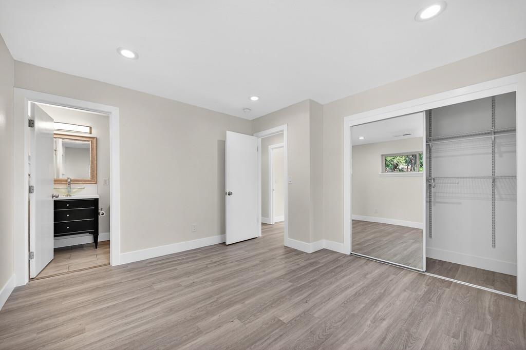 7517 Farmgate Way Citrus Heights, CA 95610 - Photo 27 of 35 an empty room with wooden floor & bathroom