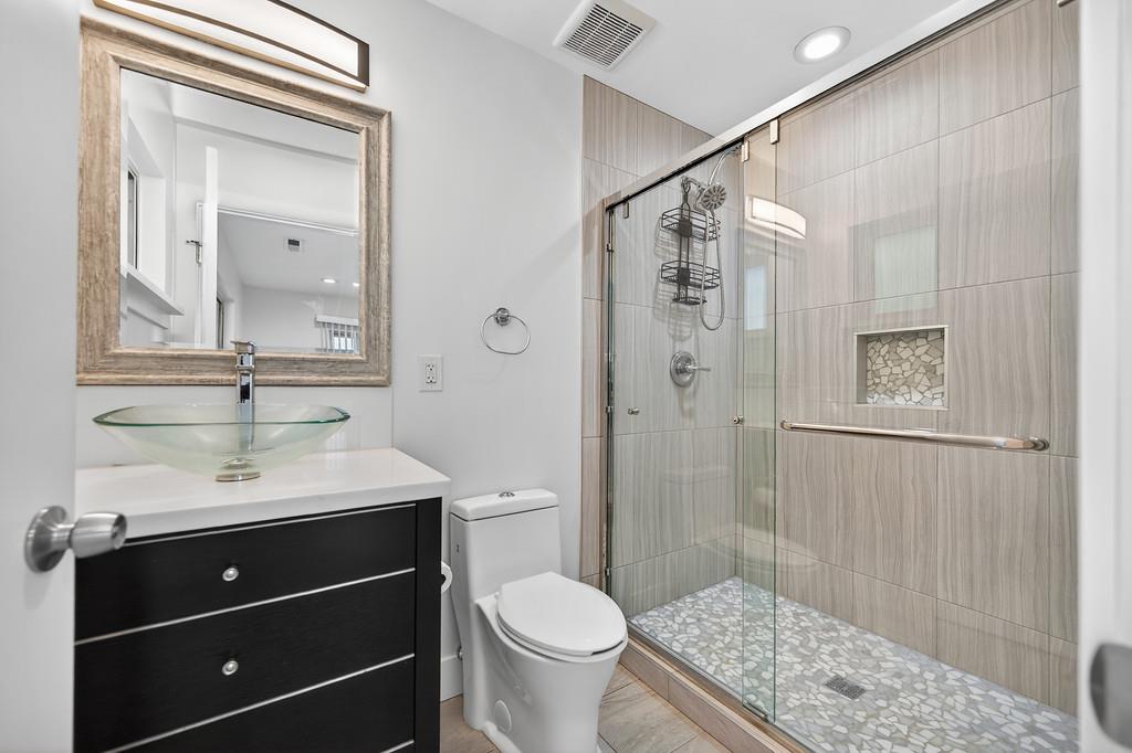 7517 Farmgate Way Citrus Heights, CA 95610 - Photo 28 of 35 a bathroom with a sink a toilet and shower