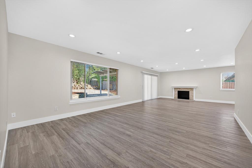 7517 Farmgate Way Citrus Heights, CA 95610 - Photo 7 of 35 a view of an empty room with wooden floor and a window