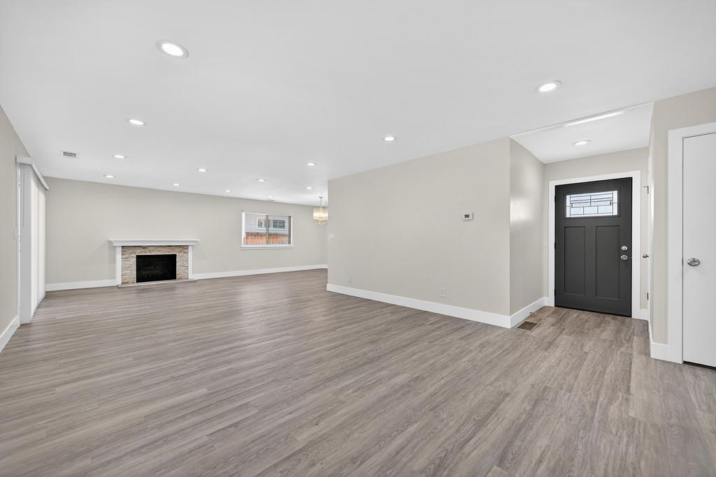 7517 Farmgate Way Citrus Heights, CA 95610 - Photo 8 of 35 an empty room with wooden floor and windows