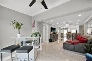 a kitchen with stainless steel appliances granite countertop a sink dishwasher a stove and white cabinets with wooden floor