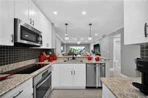 a very nice looking dining room with furniture