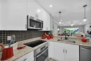 a dining room with furniture and a potted plant