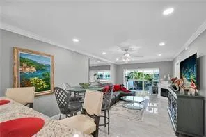 a view of a dining room with furniture and window
