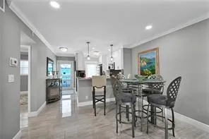 a table room with furniture and a potted plant