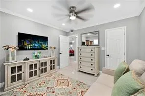 a bedroom with a bed and ceiling fan