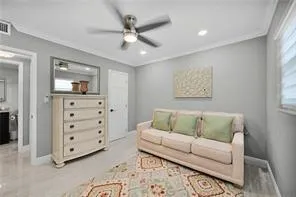 a bedroom with a bed a dresser and a window