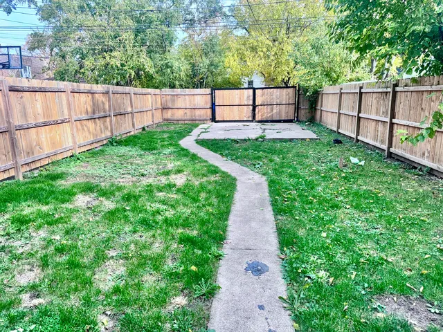 a view of a backyard with a small garden