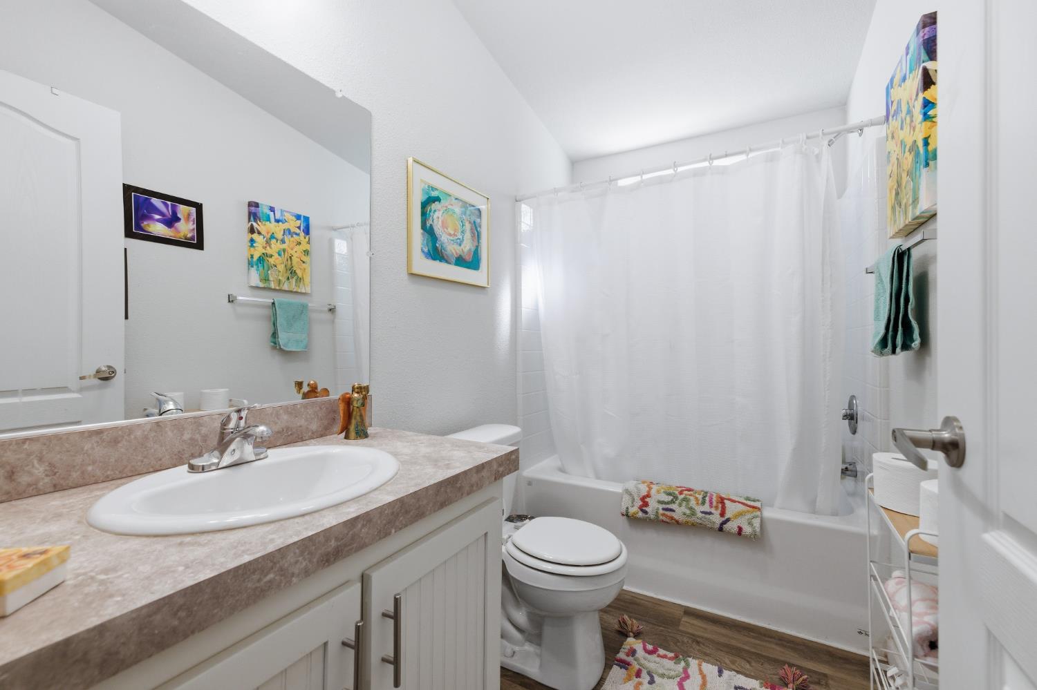 5015 Shooting Star Road Pollock Pines, CA 95726 - Photo 11 of 44 a bathroom with a granite countertop sink a toilet and a mirror