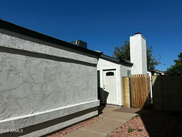 a view of a balcony with furniture