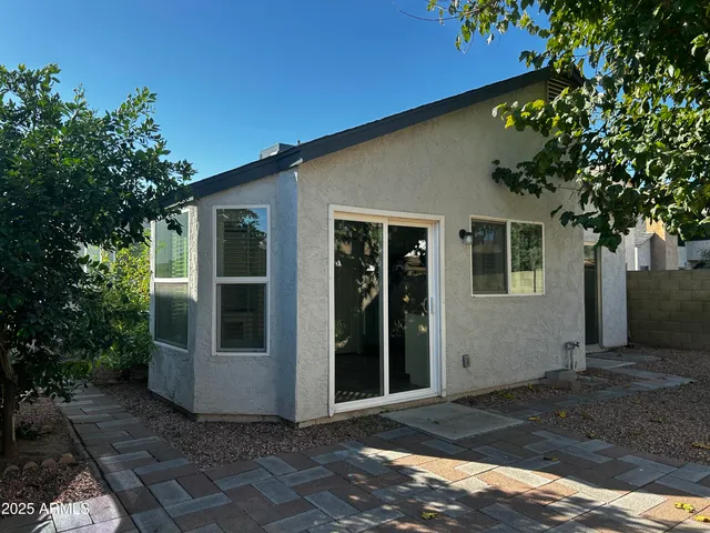 a view of a house with a tree
