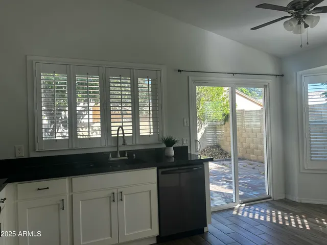 a kitchen with a sink and large window