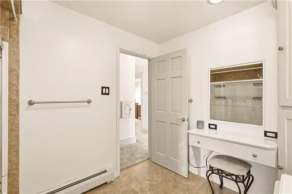 a bathroom with a shower a sink and a mirror
