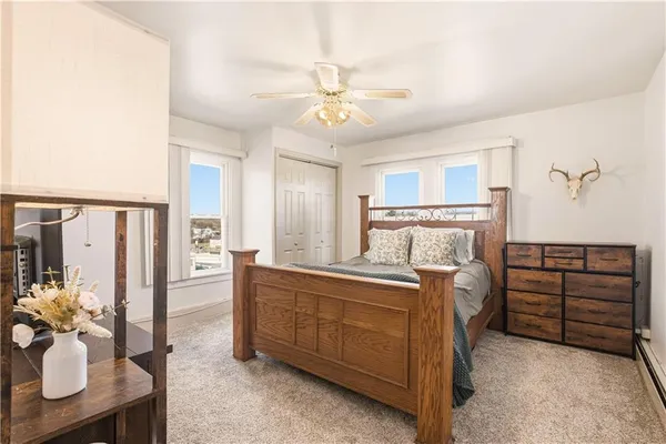 a bed room with a bed and a chandelier