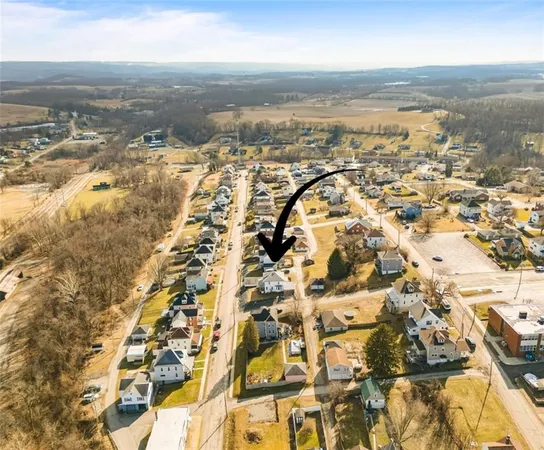 an aerial view of residential building with parking space