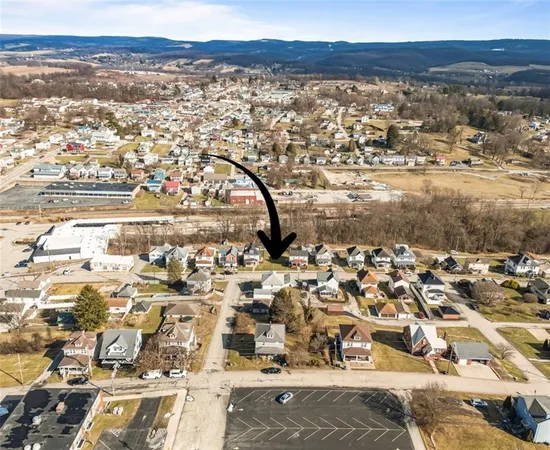 an aerial view of residential building and ocean view