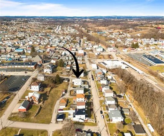 an aerial view of residential building and parking space