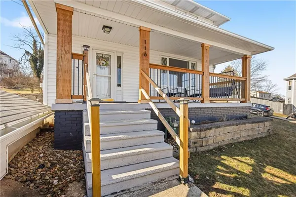 a view of a house with wooden floor and a ocean view
