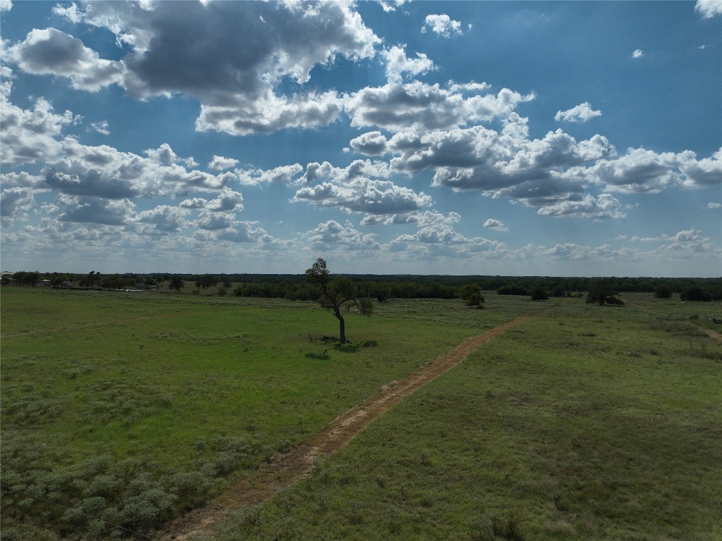 View of green lawn with a view of countryside