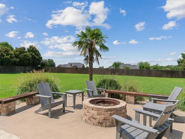 a view of a table and chairs in the garden