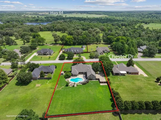 an aerial view of a house with a garden