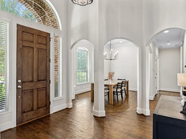 a view of a livingroom with furniture and hardwood floor