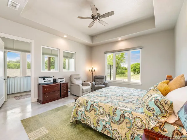 a spacious bathroom with a double vanity sink and a mirror