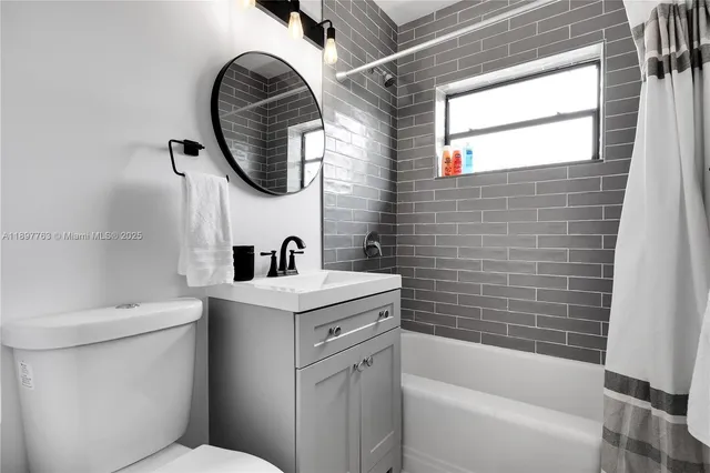 a bathroom with a sink a toilet and a bathtub