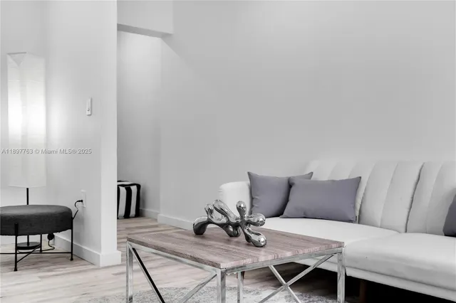 an aerial view of residential houses with city view