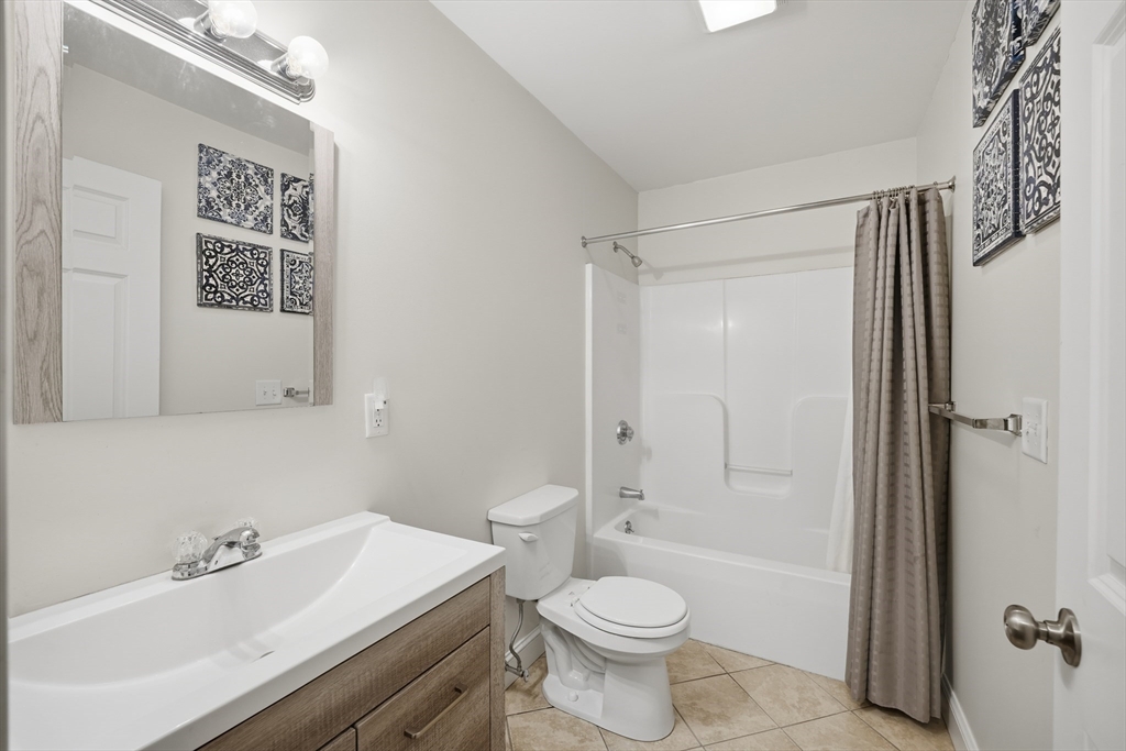 209 Osborne Road Ware, MA 01082 - Photo 17 of 32 a bathroom with a sink a toilet and shower