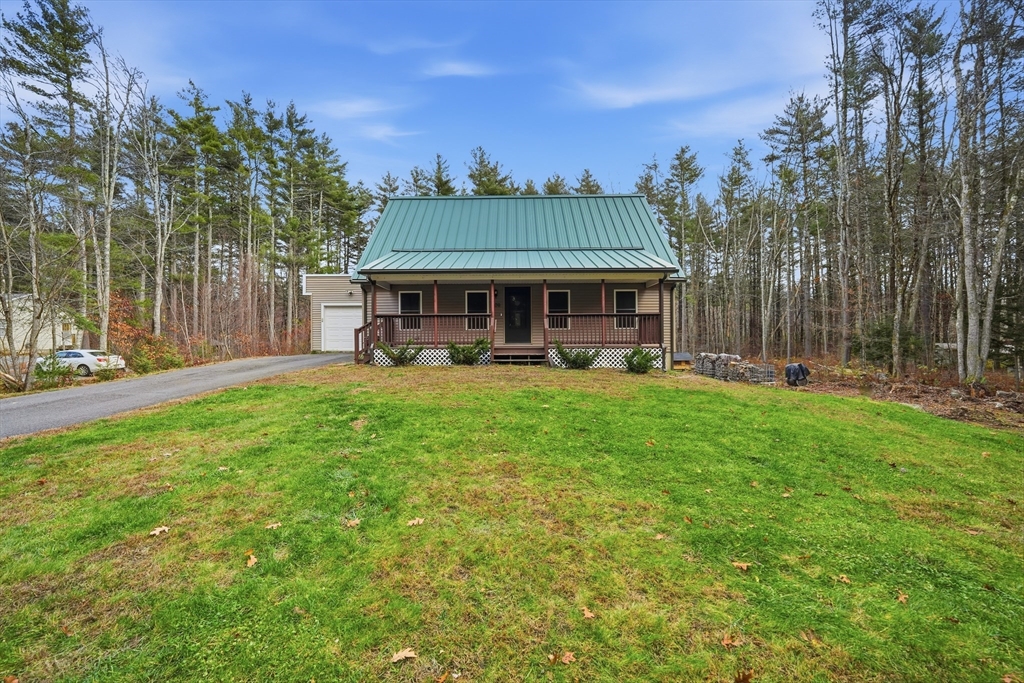 209 Osborne Road Ware, MA 01082 - Photo 2 of 32 a view of a patio with table and chairs with wooden floor and fence
