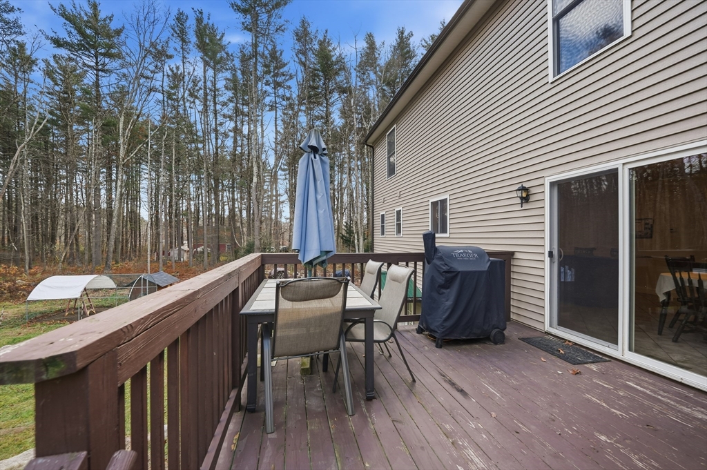 209 Osborne Road Ware, MA 01082 - Photo 27 of 32 a balcony with furniture and wooden floor