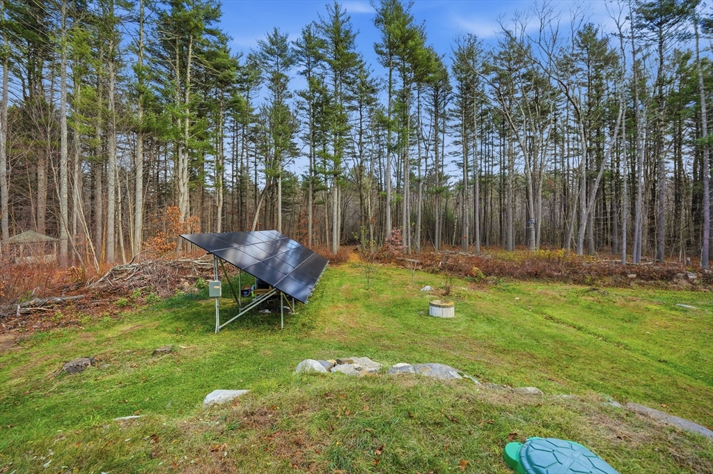 209 Osborne Road Ware, MA 01082 - Photo 28 of 32 a backyard of a house with table and chairs