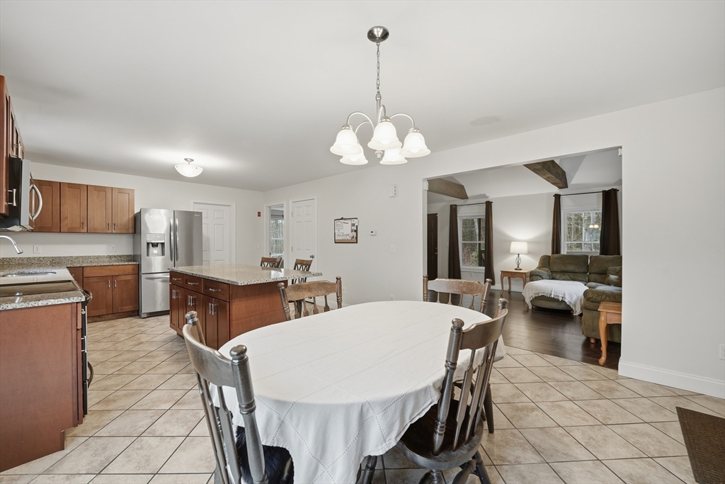 209 Osborne Road Ware, MA 01082 - Photo 10 of 32 a view of a dining room with furniture and a chandelier