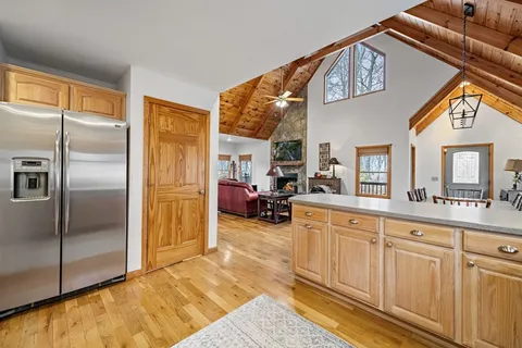 a kitchen with stainless steel appliances granite countertop a stove and cabinets