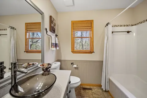 a living room with furniture and a rug