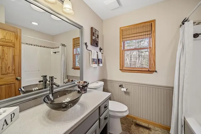 a living room with furniture and a rug
