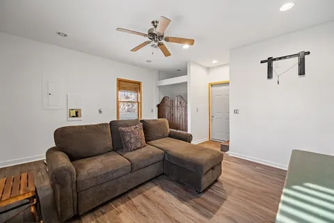 a bedroom with a bed and a chandelier