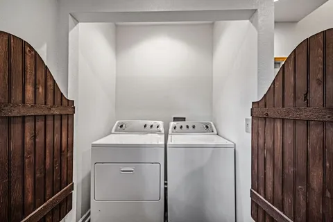 a bathroom with a shower and a door