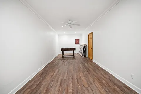 an aerial view of a house with a yard and sitting area