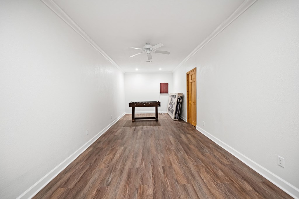 380 Oak Ridge Way Morganton, GA 30560 - Photo 47 of 67 a view of a room with wooden floor a ceiling fan and staircase