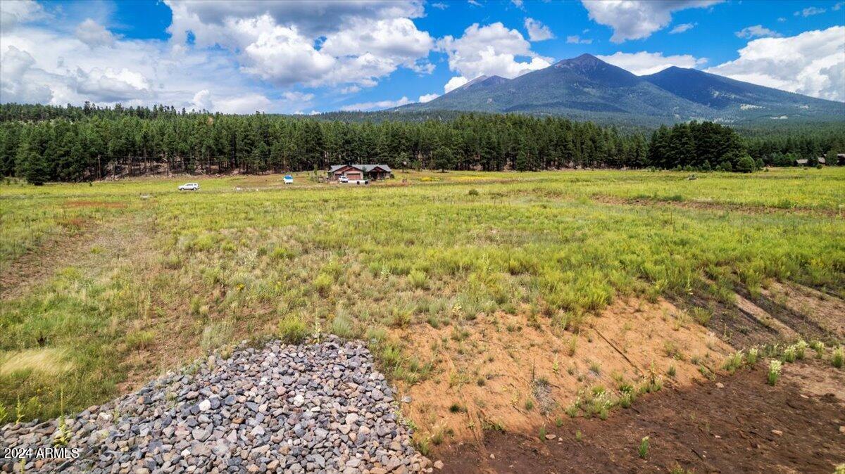 9290 Ranch At The Peaks Way, Unit 12 Flagstaff, AZ 86001 - Photo 14 of 26 a view of a yard with a table and chairs